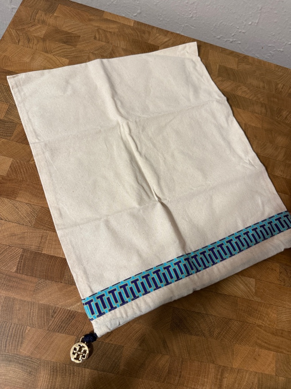 Tory Burch Cream Cotton Drawstring Pouch with Blue Trim and Logo Charm